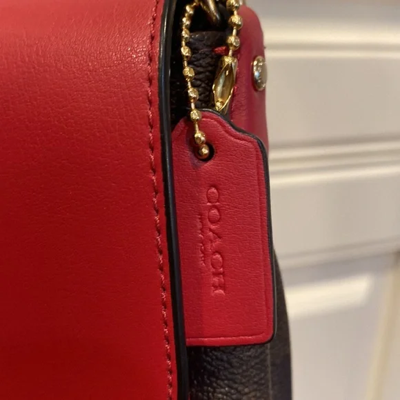 This is a like new coach cross body bag. - Picture 8 of 9